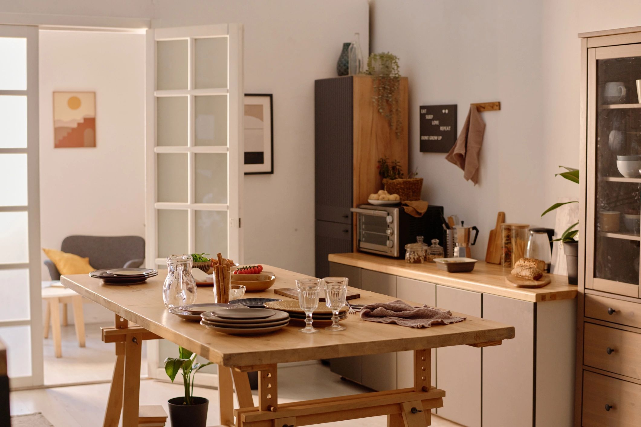 Elegant tableware display in a warm kitchen setting
