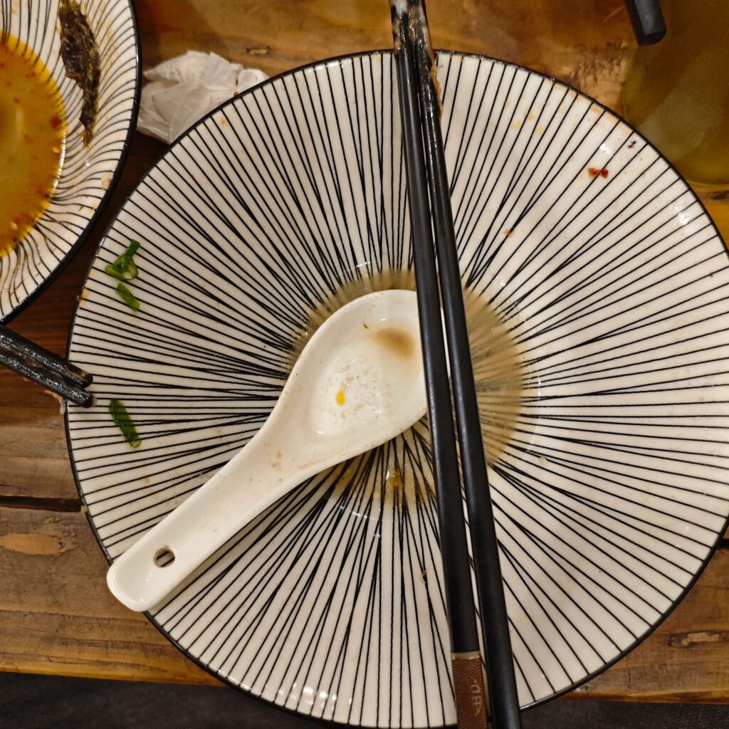 Empty sushi plate on table